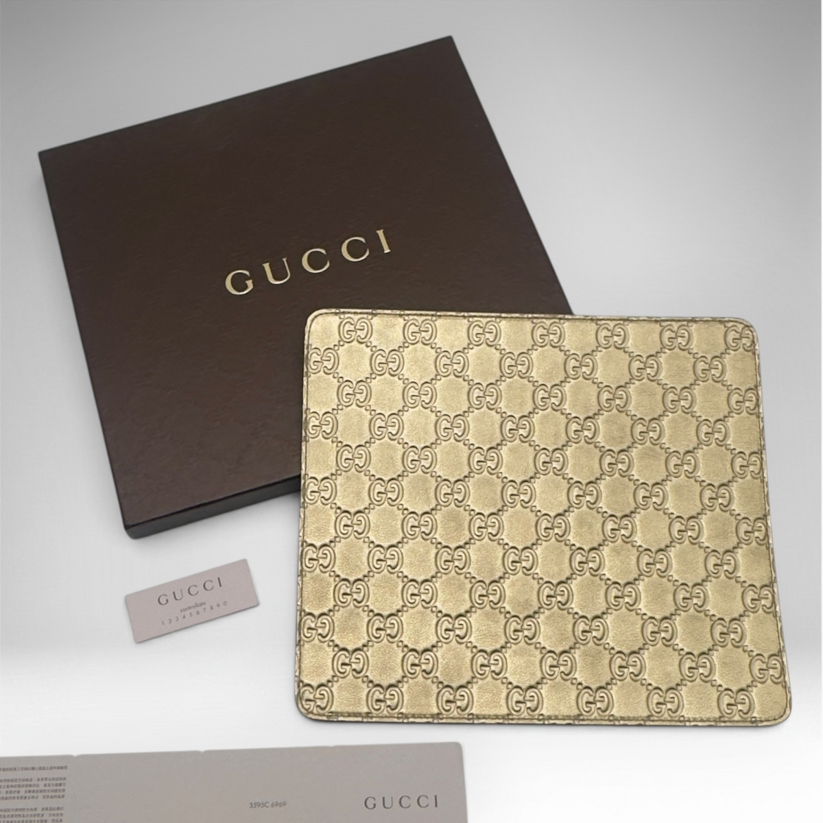 Gucci gold mousepad