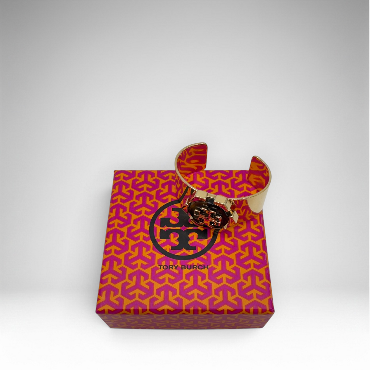 Tory Burch gold-tone open cuff bracelet with brown logo medallion and presentation box, view 2