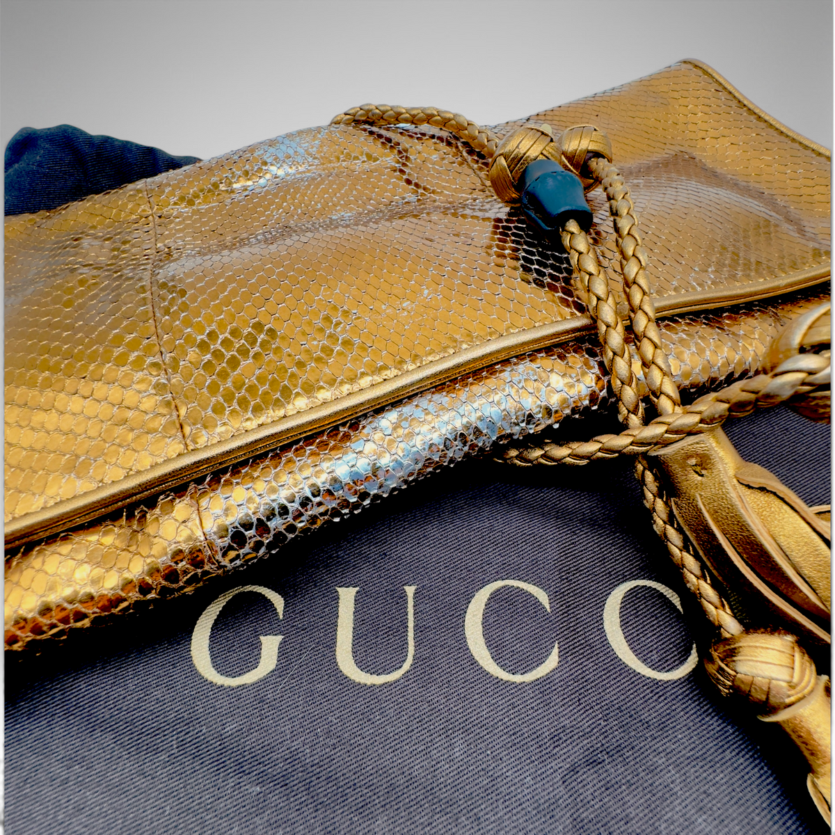 Gucci snakeskin gold clutch