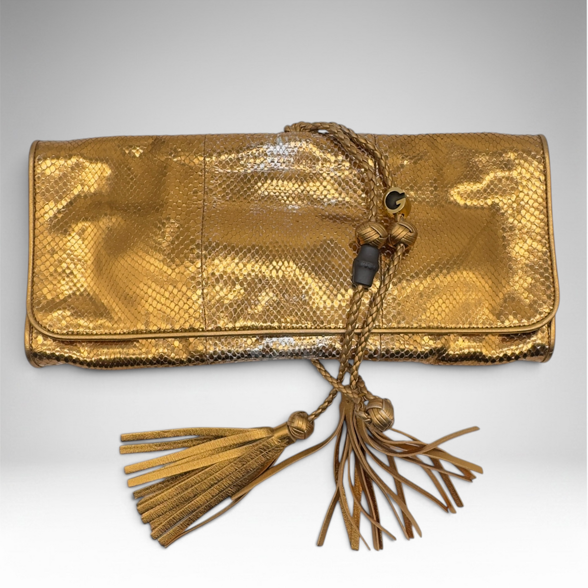 Gucci snakeskin gold clutch