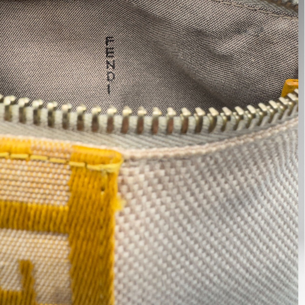 Fendi beige woven canvas pochette with mustard-yellow FF logo webbing and gold-tone zip closure, view 3